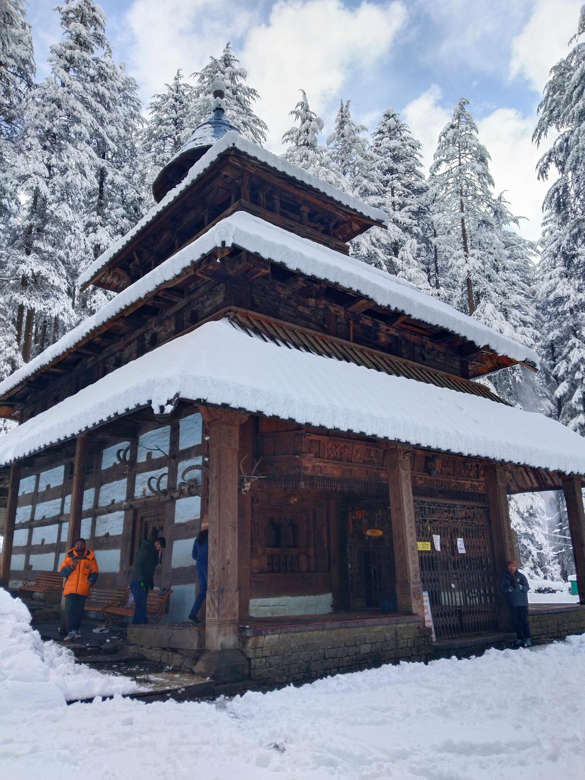 Explore the iconic Hidimba Devi Temple in Manali, draped in snow, during winter.